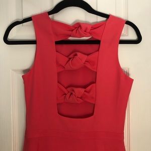 Pink dress with cut out bows on the back